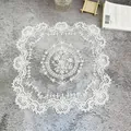 Exquisite white embroidered lace placemat detail showing intricate floral patterns - 30cm Square / White