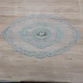 Detailed view of an oval French lace tablecloth with elegant pink floral embroidery - 44*71cm / Grey Camel