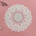 Close-up macro detail of an elegant white embroidered floral lace round coaster - 25x25cm / Glossy White