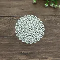 Close-up of white circular lace woven coaster with intricate floral patterns - 12*12cm / Beige