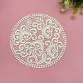 Close-up of intricate off-white lace placemat with floral embroidery on pink background. - 18x18cm / Beige