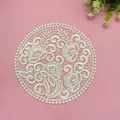 Detailed view of vintage off-white embroidered lace circular placemat on pink background - 18x18cm / Camel
