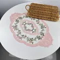 Elegant oval lace placemat with pink floral embroidery on white mesh detail view. - 36*50cm / Pink