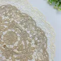 Macro detail of delicate floral embroidered lace placemat with scalloped edges - 30*45cm / Dark Camel