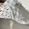 Detailed white embroidered lace tablecloth with elegant floral mesh and scalloped edges - Milk Silk Style / 30cm Round / White