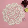 Macro view of beige round lace doily with intricate floral embroidery on pink background - 28x28cm / Camel