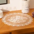 Close-up of a white floral mesh placemat on a wooden desk as a home decor detail - 30cm / Beige
