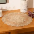 Close-up of elegant beige floral lace placemat on wooden table - 30cm / Camel