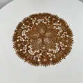 Detailed view of intricate bronze embroidered lace doily with floral patterns. - 27x27cm / Brown