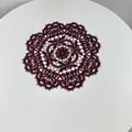 Macro detail of dark burgundy embroidered lace placemat on elegant white surface - 28cm Round / Red Brown