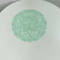 Close-up macro detail showing intricate mint green lace embroidery pattern of placemat. - 27x27cm / Fruit Green