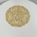 Detail view of a golden embroidered lace placemat with intricate vintage floral and lattice patterns - 27x27cm / Wheat