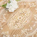 Detailed macro view of intricate hollow-out lace embroidery on a beige table runner. - 29*51cm / Beige