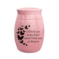 Detailed macro view of a pink mini cremation urn featuring butterfly and sentimental quote - Pink (Butterfly Quotes)