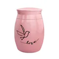 Detailed view of a pink memorial cremation urn featuring a bird and Love engraving pattern - Love and Bird Style / Pink