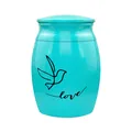 Detailed view of turquoise cremation urn with bird and love engraving on surface - Love and Bird Style / Blue