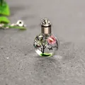 Elegant round glass urn pendant with dried pink flowers and butterfly for memorial - Style 7 (43522345)