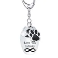 Llavero de urna para mascotas de acero con dije de huella negra y el símbolo infinito - Estilo Love You Infinity / 25*16mm / Plateado
