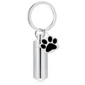 Polished silver cylinder pet urn keychain featuring a black paw print charm design. - Key Ring (38*11mm) / Silver
