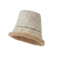 Detailed view of vintage jacquard suede bucket hat with warm sherpa lining. - Apricot