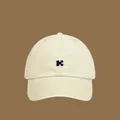 Minimalist beige cotton kids baseball cap with navy blue embroidered puzzle logo - Adjustable Circ (56-58cm) / Off White