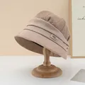 Close-up detail of stylish beige bucket hat featuring rhinestone G-buckle and knit texture - Rhinestone Metal Buckle Style / Khaki