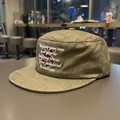 Detail of olive green flat top military cap featuring white inspirational embroidery - Olive Army Green