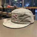 Close-up of grey washed flat top cadet cap with motivational embroidery - Light Lime