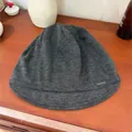 Comfortable dark grey retro pleated knitted beanie with short brim and metal tag detail - Gray