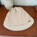 Stylish beige slouchy beanie with short brim and vintage pleats for women - Off White