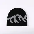 Stylish black knit beanie with grey mountain jacquard pattern for winter streetwear - One Size / Black