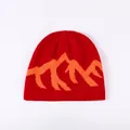 Stylish red winter knit beanie featuring a vibrant orange mountain jacquard design - One Size / Red