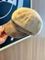 Detailed macro view of khaki suede newsboy cap with a brown PU leather brim splicing design - Light Khaki