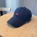 Washed navy blue vintage baseball cap featuring red fish embroidery and slogan - Navy Blue