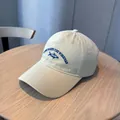Beige washed cotton baseball cap featuring blue fish embroidery and slogan detail - Yellow