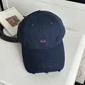 Dark navy blue embroidered baseball cap with distressed brim details - Navy Blue