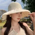 Detail view of elegant women's breathable mesh sun hat with rhinestone accents for summer - Beige