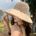 Beige breathable mesh sun hat with a ruffled brim and rhinestones on female model - Khaki