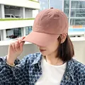 Close-up of quick-dry baseball cap in pink on female model - Light Orange