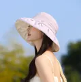 Detail view of an elegant pleated lavender sun hat for women featuring a wide brim design - Purple