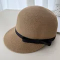 Elegante cappello da equitazione in paglia beige con fiocco nero per protezione solare estiva. - Kaki