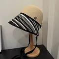 Stylish women's straw sun hat with black and white striped brim and chin ribbon ties. - Black Zebra Patchwork