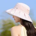 Profile detail of elegant pink pleated sun hat for women with small logo accent - Pink