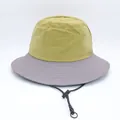 Detail of a two-tone bucket hat with an adjustable chin strap and ripstop fabric - Gray