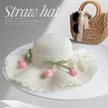 Elegant cream wide brim straw hat with lace edge and pink tulip floral decoration SKU - White