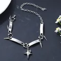 Detail view of a stainless steel punk choker with star charm and spike rivets - Starburst Rivet Punk Style (A-2721)