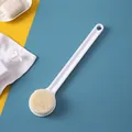 White long-handled bath brush with soft bristles for easy back scrubbing and exfoliation - White