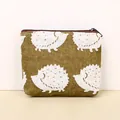 Compact canvas coin purse featuring cute white hedgehog print on olive green background - Hedgehog