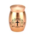 Close-up detail of small rose gold aluminum urn featuring cross and dove engraving - 30x40mm / Rose Gold