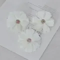 Set of three white fabric daisy flower heads for DIY hair accessories and crafts - White